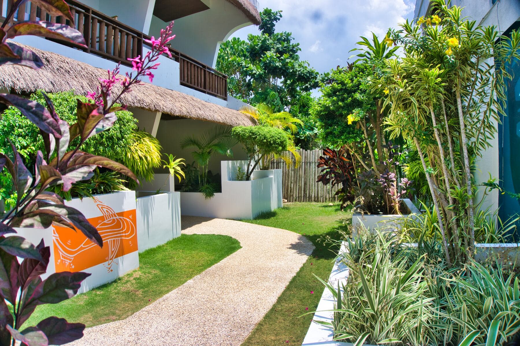 Garden pathway between resort buildings