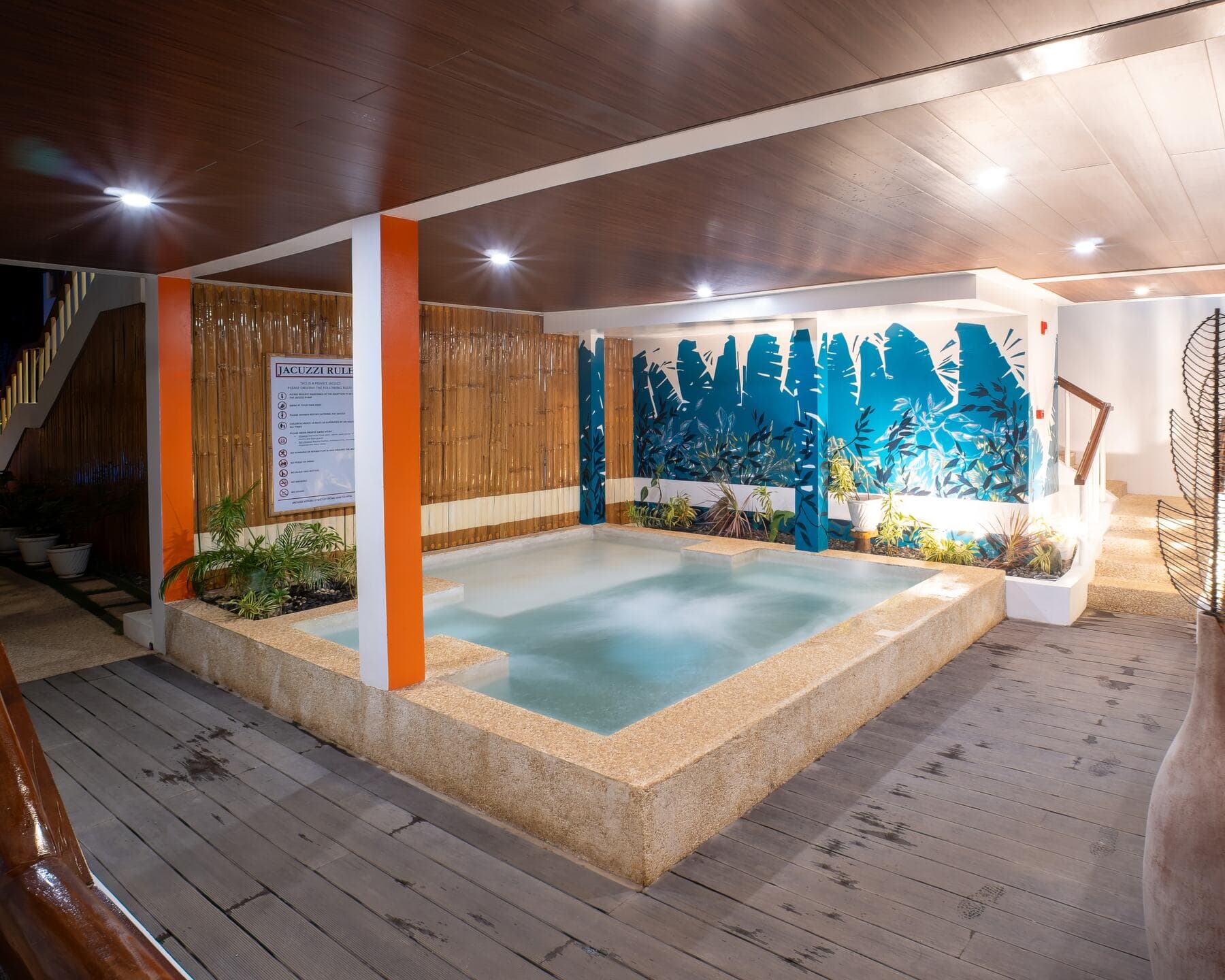 Indoor jacuzzi with tropical mural